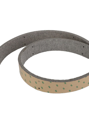 The AGCO Seal - Acx3272150 is a coiled strip of adhesive-backed, grey felt material with several small holes along its length.