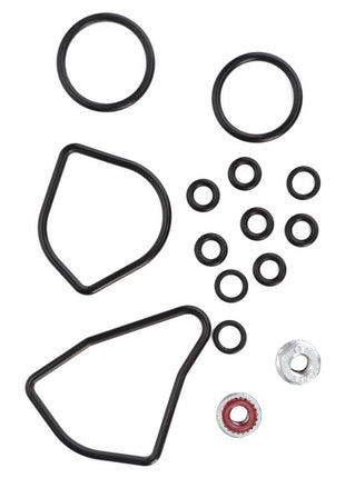 Assorted black and silver O-rings and gaskets of various shapes and sizes are neatly arranged on a white background. No current product description available for the AGCO Seal Kit - F210962020080 by AGCO.