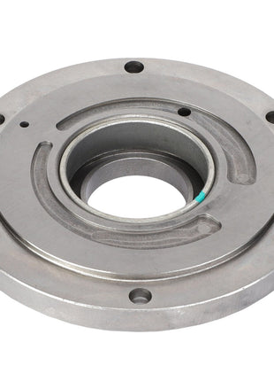 The AGCO COVER - AG137553 is a circular metallic mechanical part featuring a central hole and several smaller holes around the perimeter, likely intended for mounting or rotating purposes in machinery. No further product description information is available at this time.