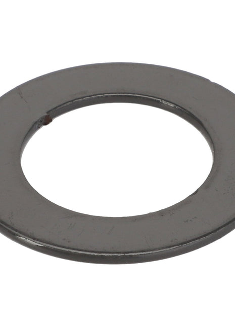 The AGCO Adjusting Shim ACY1217130 is a flat, round metal washer with a central hole, typically used to distribute the load of a threaded fastener.