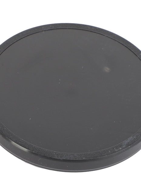 A black circular coaster or lid with a smooth surface, identified as the AGCO | Seal Cap - Acp0287200 by the brand AGCO, is shown against a plain white background. No current product description available for this item.