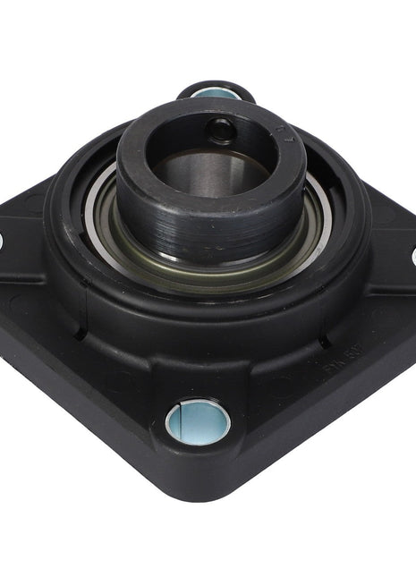 The AGCO | Bearing And Flange Assembly - Acx0149000, viewed from above, exhibits a steel square duct flange with an embedded bearing. The flange includes a central cylindrical opening and four mounting holes positioned at each corner.