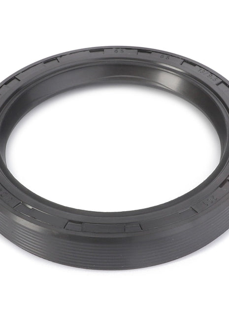 A shaft seal named AGCO | Shaft Seal - F283101150080 from the brand AGCO, featuring a circular black rubber design with ridged edges and numerical markings along the inner rim. No current product description available for similar items.