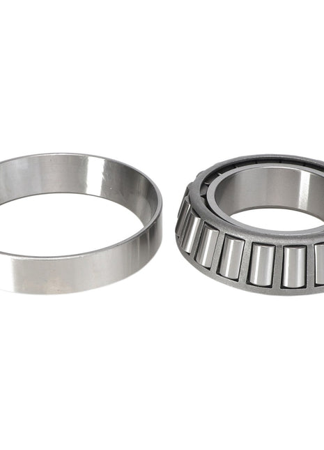 This product description showcases an image of the AGCO | BEARING CUP - ACP0226730 with its outer race separated. The roller bearing features tapered cylindrical rollers, while the outer race presents as a smooth, ring-like component. For more details or inquiries, please contact our support team.