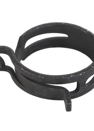 The AGCO Clip (Model F524880010220) is a sleek, black circular metal clamp featuring open slots around its circumference and a protruding tab on one side, making it an ideal choice for various applications.
