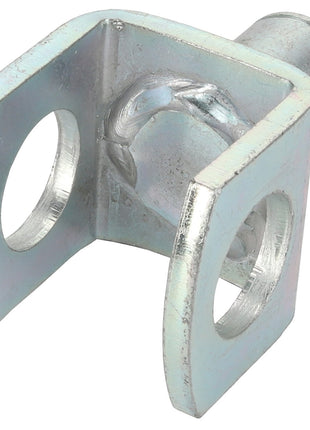 Close-up of the AGCO | Yoke - Acw1701230 bracket with two circular holes on each side and a cylindrical attachment on one end, slightly tarnished.