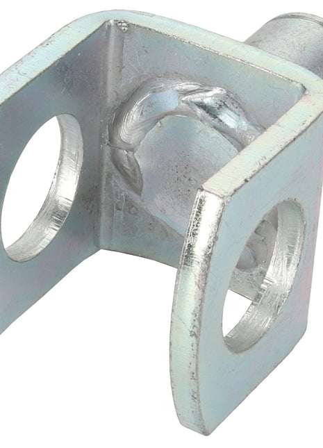 Close-up of the AGCO | Yoke - Acw1701230 bracket with two circular holes on each side and a cylindrical attachment on one end, slightly tarnished.