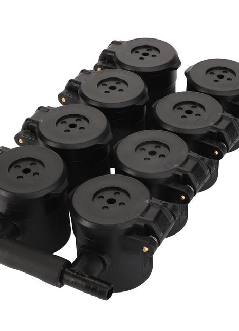 This product, the AGCO | Cap - Acp0671420 by AGCO, is a set of eight black round electrical connectors with multiple holes and attached cables, arranged neatly in two rows.