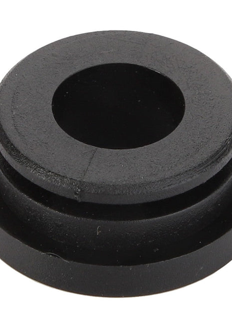 AGCO | Bush - F158500030030: A black rubber grommet featuring a central hole and a grooved edge. No current product description available for this product from AGCO.