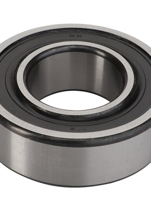 The AGCO Ball Bearing - Acp0281060 is a durable metal cylindrical bearing featuring an inner and outer ring. It also includes a black rubber seal securely fitted around the inner ring.