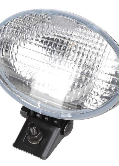 The AGCO | WORKLIGHT - AG122573 is an oval-shaped clear glass headlight featuring a ribbed surface, mounted on a black base with a screw for attachment. No further product description information is available at this time.