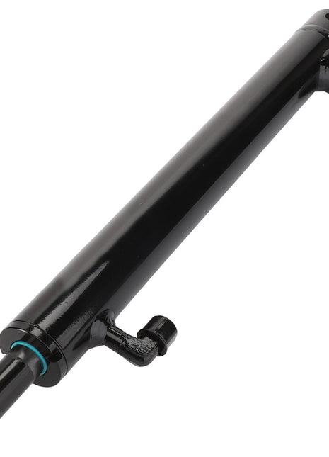 The AGCO | Cylinder - Acw4275490 is a sleek, black hydraulic cylinder with a smooth, cylindrical body featuring attachment points at both ends and an inlet/outlet port near one end. There is no information available about its operating pressure or capacity.