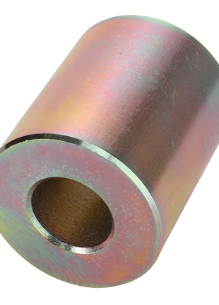 The AGCO BUSH - D28282760 is a cylindrical metal spacer with a central hole and a slightly iridescent surface. No current product description information available.