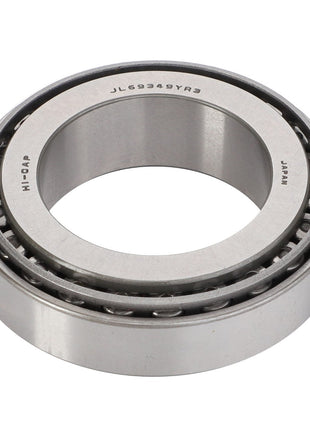 The AGCO Taper Roller Bearing - F514100360390 is constructed with an inner and outer ring, designed to handle both radial and thrust loads. Featuring multiple rollers in the inner ring, this bearing is marked with "JL69349Y2R3" and "JAPAN".