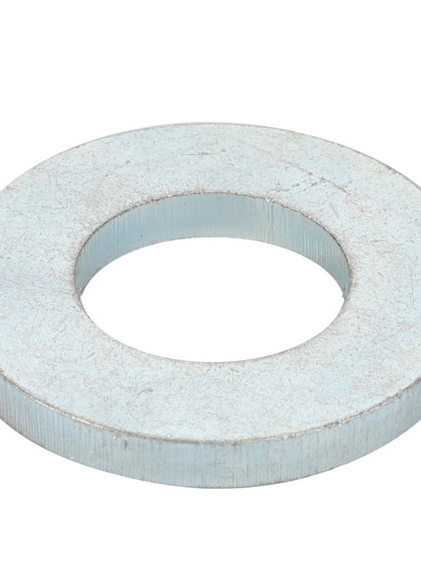 The AGCO | SPACER - D20400522 by AGCO is a durable metallic washer with a circular hole in the center, ideal for various fastening applications.