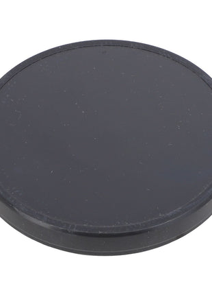 A round, flat, black object with a smooth surface—product name: AGCO | Seal Cap - Acp0287790 by AGCO.