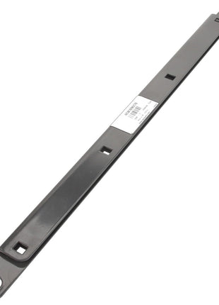 A long, rectangular metal bracket named "Clamp - Acw1696270" by AGCO features a hole at each end and several square cutouts along its length. In the center, there is a white product label with a barcode and some printed text. Please note: No current product description information is available beyond this label.