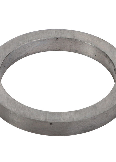 Viewed from an angle, the AGCO | INTERMEDIATE RING - V30386300 is a metallic washer ring with a circular shape and a central hole.