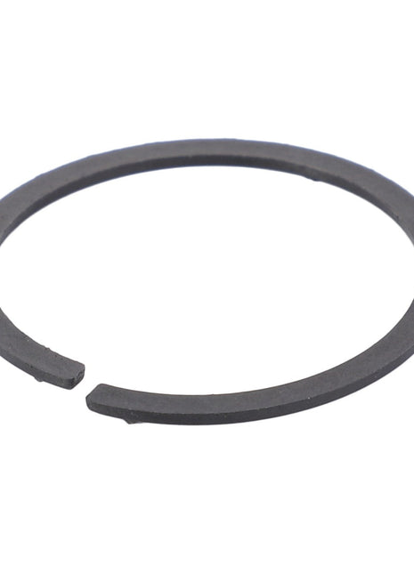 The AGCO Spacer Ring - F119200710180 from the reputable brand AGCO is crafted from dark grey metal and features an open-ended snap ring design, ideal for securing the position of components on a shaft or in a bore.