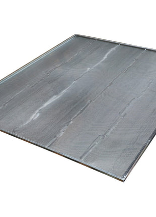 The AGCO Sieve - La320959650 is a metal baking sheet with raised edges, shown angled slightly above the surface. The sheet has a smooth, reflective finish. No current product description available.