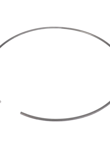 A close-up of the AGCO LOCK WASHER - F718301020380, featuring a metal ring with an open end, forming a nearly complete circle.