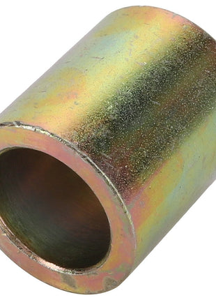 The AGCO Spacer - 6209926M1 is a metallic cylindrical bushing with an open center, featuring a slightly rough and textured surface and a yellowish tone. No current product description is available for additional specifications.