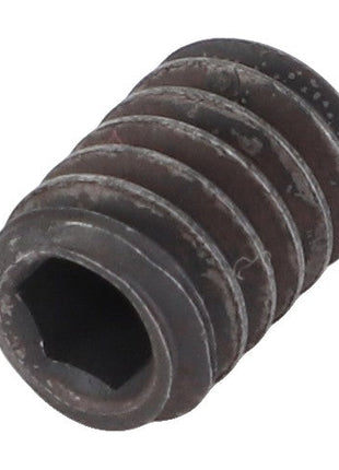 A close-up image of the AGCO | Jet - Acw2926560, a dark-colored, cylindrical threaded insert featuring a hexagonal hole in the center. No additional product description or details about its specific use are provided.