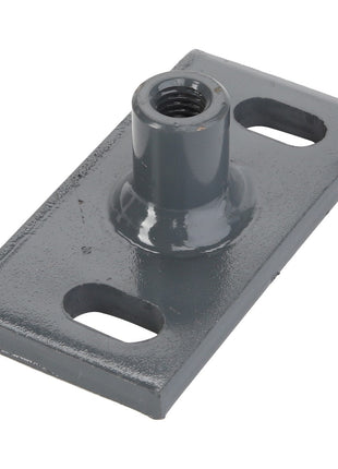 The AGCO | SPRING - D28880502 features a metal rectangular base with rounded corners and two holes at each end. It also includes a central cylindrical threaded extension for fastening. There is no available information regarding its origin.