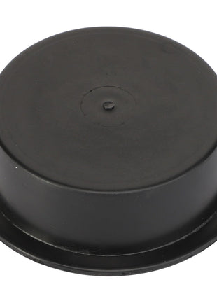 The AGCO COVER - AL5221165 is a round, black rubber plug with a flat top and subtly tapered sides.