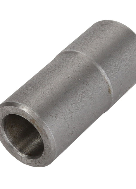 An AGCO Bush - Acp0322950, a cylindrical metal spacer from the AGCO brand, features a hollow center, smooth surface, and a precise groove near one end.