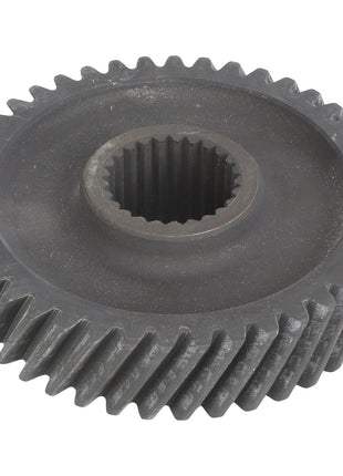 The AGCO | Drive Gear - Acw1692820 is a metal gear with helical teeth and a central hole featuring internal splines.