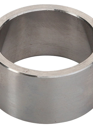 A cylindrical metal ring with a smooth surface and an open center, identified as the AGCO | SPACER - D46140005 by the brand AGCO, is shown from a slight angle. Currently, no detailed product description information is available.
