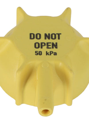 AGCO Valve - F530200050620 in a bright yellow color features "DO NOT OPEN 50 kPa" clearly printed on the cap, ensuring safety.