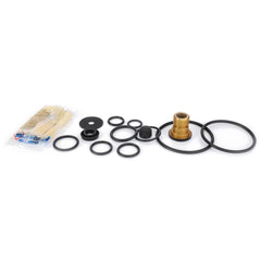 On a white background, the AGCO Repair Kit for Trailer Brake Valve (F916881120010) is displayed, featuring various black rubber O-rings, a brass fitting, and a small packet of lubricant—perfect for brake repair.