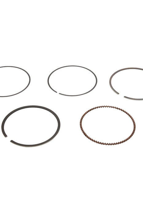 Displayed against a white background are five distinct AGCO rings, part of the "KIT, RING - ATV3402-266" collection. Four of these metal rings are flat and solid, while one features a unique beaded texture. Currently, no additional product description information is available.