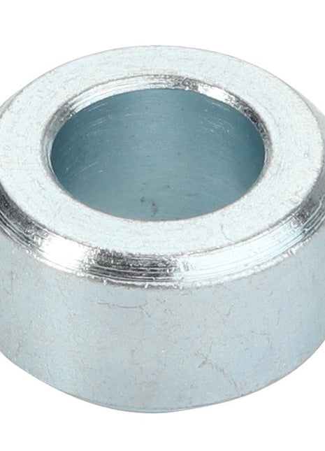 A metallic washer with a circular hole in the center, featuring a smooth, reflective surface. Product Name: AGCO | Spacer - Acp0418830 by AGCO.