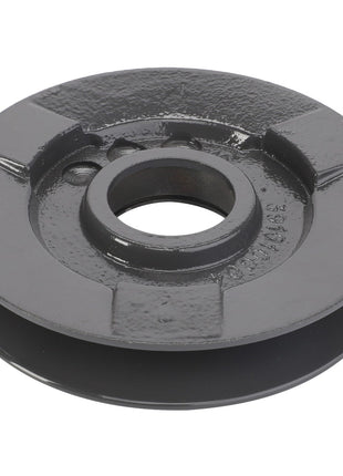 The AGCO | Belt Tensioner - La300010534 is a black, round metal pulley featuring a central hole and a groove around its circumference. Its surface is slightly textured with visible casting marks.