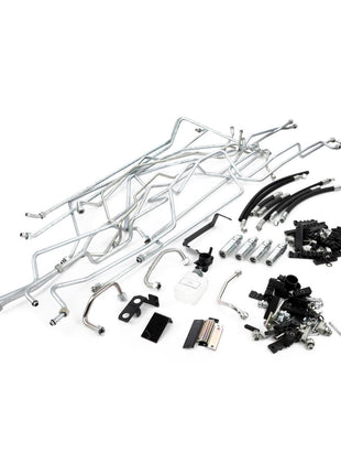 The AGCO Hydraulic Kit (Acp0662370) by AGCO includes a variety of metal and plastic components, such as pipes, fittings, a bottle, brackets, and fasteners, making it an essential part of any complex industrial or mechanical assembly kit.