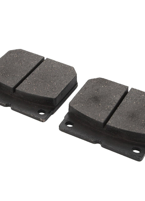 Two dark-colored automotive brake pads, identified as AGCO LA312969000 and rigorously proven through laboratory testing, are shown side by side against a white background.