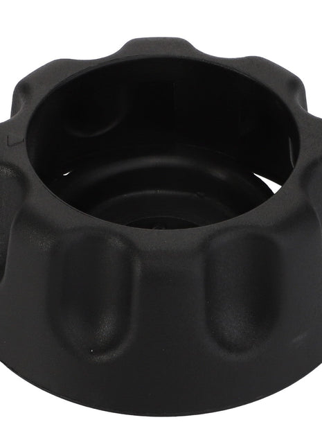 AGCO's Safety Handle - F650813360940 is a black plastic knob featuring a round, hollow center and subtly ridged edges.