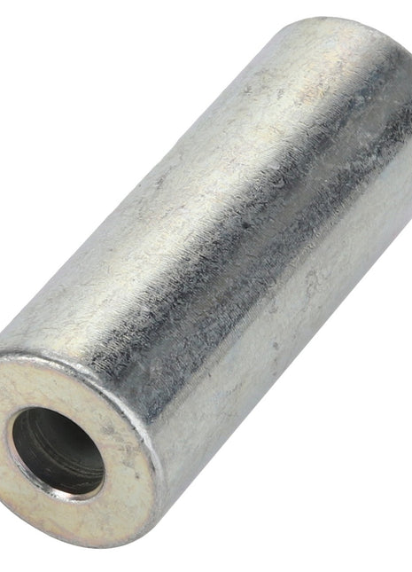 A close-up shot of the AGCO Spacer - Acw4031840, a cylindrical metal spacer with a hollow center and a smooth, shiny surface. No current product description information is available.