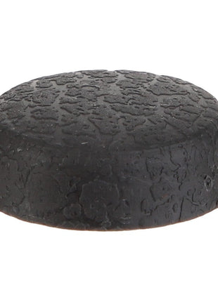 The AGCO | CAP - D45745105 by AGCO is a black, textured rubber bumper with a flat top and slightly rounded edges, making it perfect for protective cushioning or as an effective stopper.