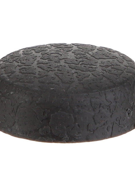 The AGCO | CAP - D45745105 by AGCO is a black, textured rubber bumper with a flat top and slightly rounded edges, making it perfect for protective cushioning or as an effective stopper.
