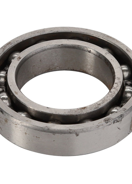 The AGCO DEEP GROOVE BALL BEARING - ACY9102740 is a sturdy component, characterized by its seamless circular outer ring and intricate inner workings.