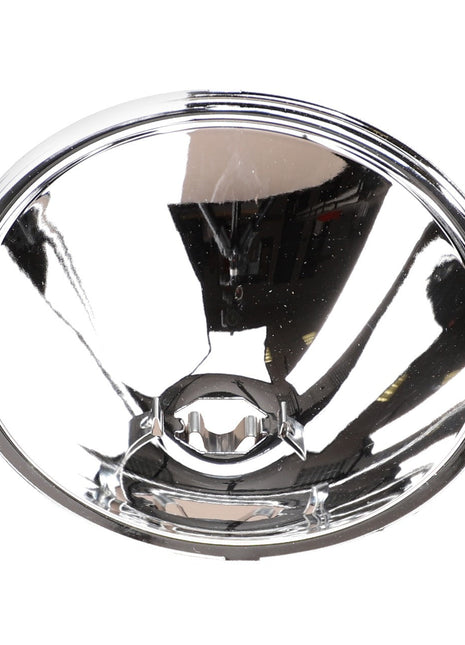 Close-up of a circular, reflective, chrome-like metal object with a concave shape. The center features a small, protruding mechanism designed to hold the AGCO Genuine Headlight (Product Name: AGCO | Headlight, Roof, Combiner - D45080002) for greater illumination on your tractor.