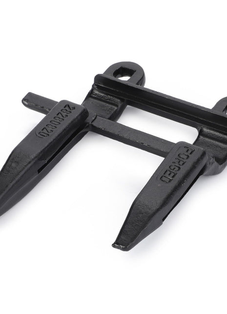 Introducing the AGCO 1st Sickle Guard RH Side - D28280820, a black, dual-pronged metal attachment with two mounting holes and the word "FORGED" inscribed on it. This product features genuine ACGO Parts for superior cutting performance.