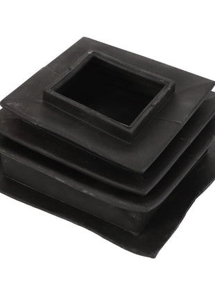 The AGCO | BELLOWS - D28980671 by AGCO is a black, square-shaped flexible boot with a stepped design, likely used for sealing pipes or ducts. No current product description information is available.