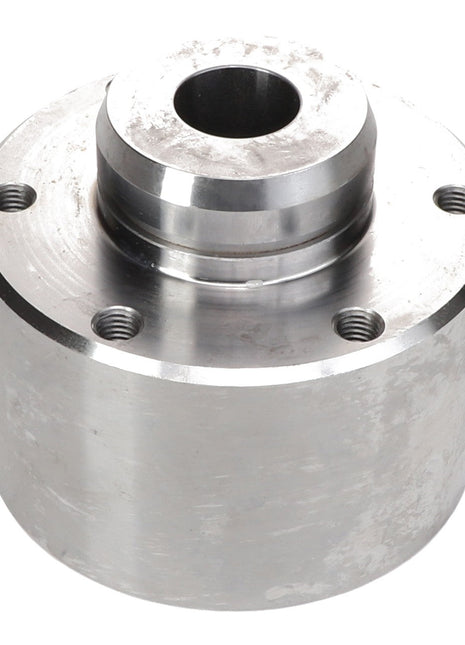 The AGCO Bearing Housing - Acx2744570 is a cylindrical metal casing featuring four threaded holes and a central circular opening on the top face.