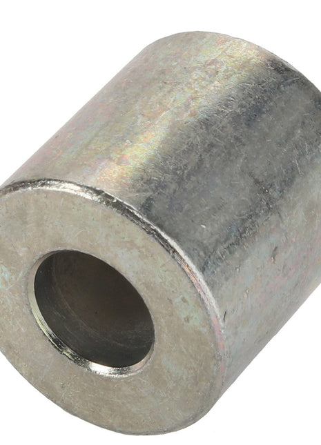 The AGCO Spacer - Acw1023380 is a cylindrical metal spacer featuring a central hole, designed to maintain space between two parts. Product description information is currently unavailable.