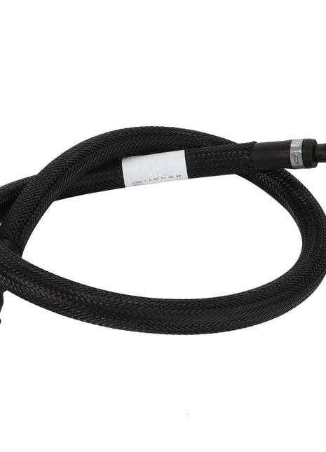 The AGCO | Fuel Hose - Acw4052320 by AGCO is a coiled black braided hose with connectors on both ends, designed for exceptional durability and flexibility.